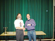 Steve Crockett receives his prize in the under-120 tournament from Dave Thomas, Warks President